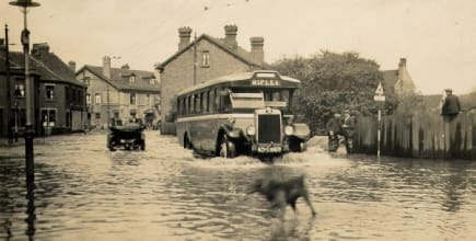 MGO bus battling with the flood water on Station Road, Langley Mill, May 1932.