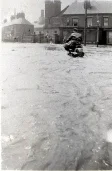 an intrepid motorcyclist makes his way along Station Road away from the junction with Cromford Road.