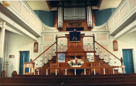 Interior views of the church before and after the alterations of 1993, which removed the organ and hid the first floor balcony.